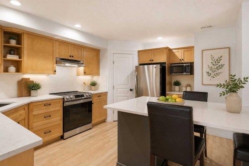2-435 13 Avenue Ne, Calgary, AB - Indoor Photo Showing Kitchen With Stainless Steel Kitchen