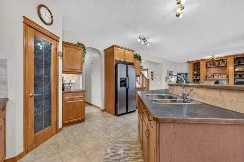 10 Westmount Road, Okotoks, AB - Indoor Photo Showing Kitchen With Double Sink