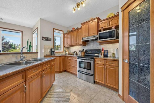 10 Westmount Road, Okotoks, AB - Indoor Photo Showing Kitchen With Double Sink