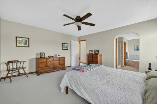 10 Westmount Road, Okotoks, AB - Indoor Photo Showing Bedroom
