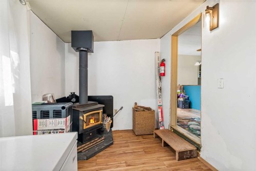 2104 23 Avenue, Delburne, AB - Indoor Photo Showing Other Room With Fireplace