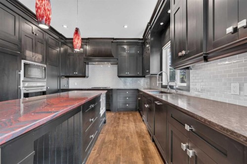 4 Aspen Cliff Close Sw, Calgary, AB - Indoor Photo Showing Kitchen With Double Sink