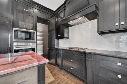 4 Aspen Cliff Close Sw, Calgary, AB - Indoor Photo Showing Kitchen With Upgraded Kitchen