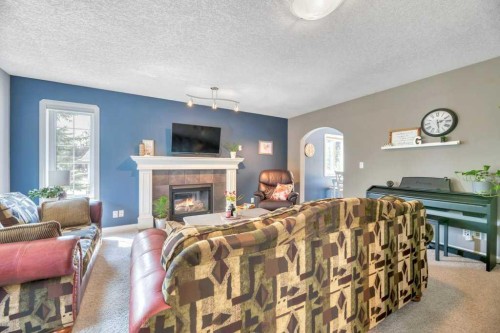 3 Grande Point Estates, Strathmore, AB - Indoor Photo Showing Living Room With Fireplace