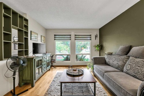 151 Midbend Place Se, Calgary, AB - Indoor Photo Showing Living Room