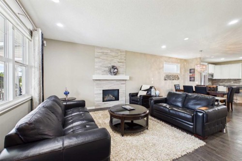 83 Redstone Gardens Ne, Calgary, AB - Indoor Photo Showing Living Room With Fireplace