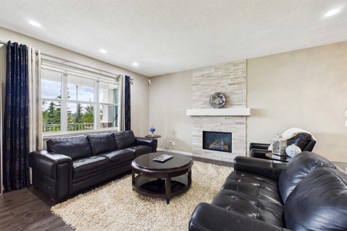 83 Redstone Gardens Ne, Calgary, AB - Indoor Photo Showing Living Room With Fireplace