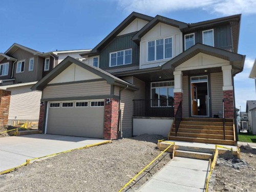 270 Greystone Boulevard, Cochrane, AB - Outdoor With Facade