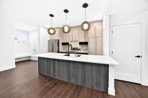 270 Greystone Boulevard, Cochrane, AB - Indoor Photo Showing Kitchen With Upgraded Kitchen
