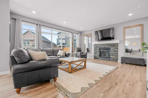 471 Canals Boulevard Sw, Airdrie, AB - Indoor Photo Showing Living Room With Fireplace