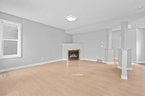 187 Martinvalley Crescent Ne, Calgary, AB - Indoor With Fireplace