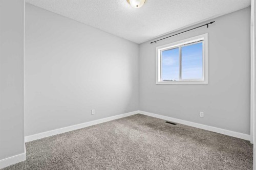 187 Martinvalley Crescent Ne, Calgary, AB - Indoor Photo Showing Other Room