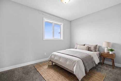187 Martinvalley Crescent Ne, Calgary, AB - Indoor Photo Showing Bedroom