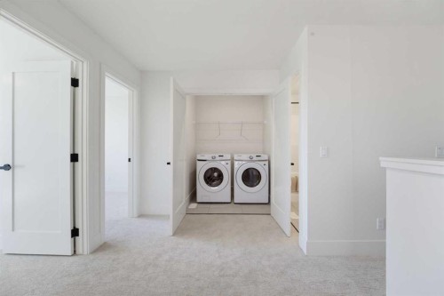266 Greystone Boulevard, Cochrane, AB - Indoor Photo Showing Laundry Room