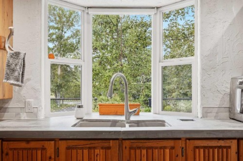 725 Calkins Place, Diamond Valley, AB - Indoor Photo Showing Kitchen With Double Sink
