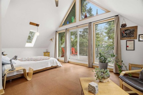725 Calkins Place, Diamond Valley, AB - Indoor Photo Showing Bedroom