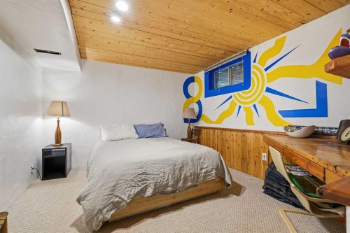 725 Calkins Place, Diamond Valley, AB - Indoor Photo Showing Bedroom