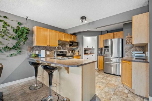 163 West Lakeview Passage, Chestermere, AB - Indoor Photo Showing Kitchen With Stainless Steel Kitchen With Double Sink