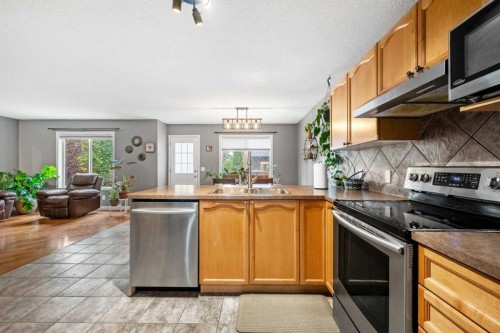 163 West Lakeview Passage, Chestermere, AB - Indoor Photo Showing Kitchen With Stainless Steel Kitchen With Double Sink