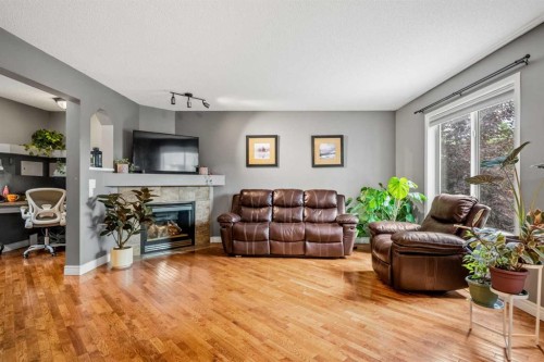 163 West Lakeview Passage, Chestermere, AB - Indoor Photo Showing Living Room With Fireplace