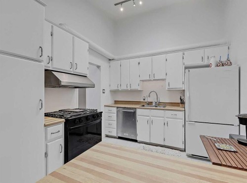 247 Simons Road Nw, Calgary, AB - Indoor Photo Showing Kitchen With Double Sink