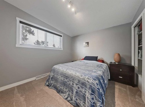 247 Simons Road Nw, Calgary, AB - Indoor Photo Showing Bedroom