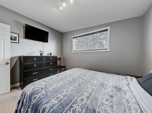 247 Simons Road Nw, Calgary, AB - Indoor Photo Showing Bedroom