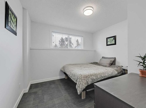 247 Simons Road Nw, Calgary, AB - Indoor Photo Showing Bedroom