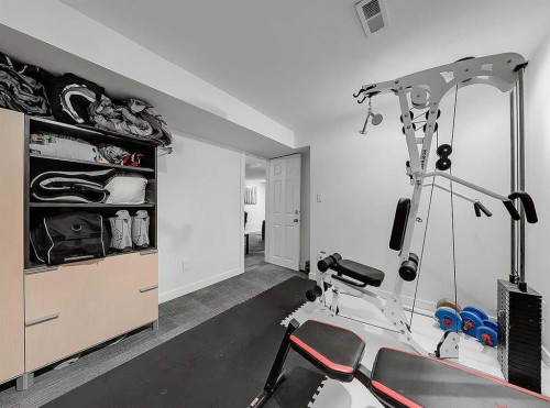 247 Simons Road Nw, Calgary, AB - Indoor Photo Showing Gym Room