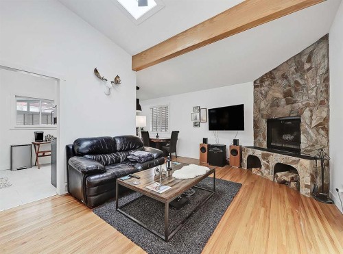 247 Simons Road Nw, Calgary, AB - Indoor Photo Showing Living Room With Fireplace