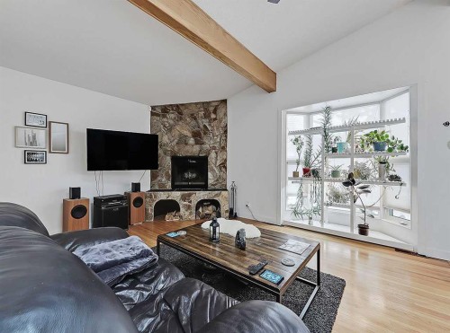 247 Simons Road Nw, Calgary, AB - Indoor Photo Showing Living Room With Fireplace