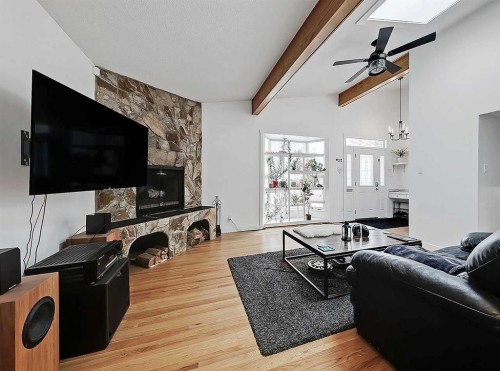 247 Simons Road Nw, Calgary, AB - Indoor Photo Showing Living Room With Fireplace