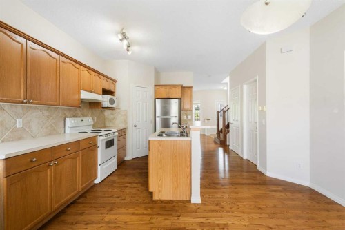 459 Evermeadow Road Sw, Calgary, AB - Indoor Photo Showing Kitchen With Double Sink