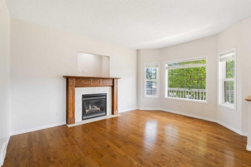 459 Evermeadow Road Sw, Calgary, AB - Indoor Photo Showing Living Room With Fireplace