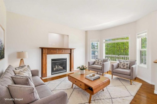 459 Evermeadow Road Sw, Calgary, AB - Indoor Photo Showing Living Room With Fireplace