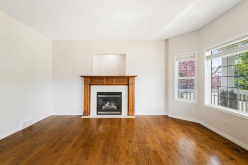 459 Evermeadow Road Sw, Calgary, AB - Indoor Photo Showing Living Room With Fireplace