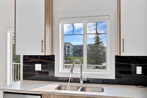 1125 Channelside Drive Sw, Airdrie, AB - Indoor Photo Showing Kitchen With Double Sink
