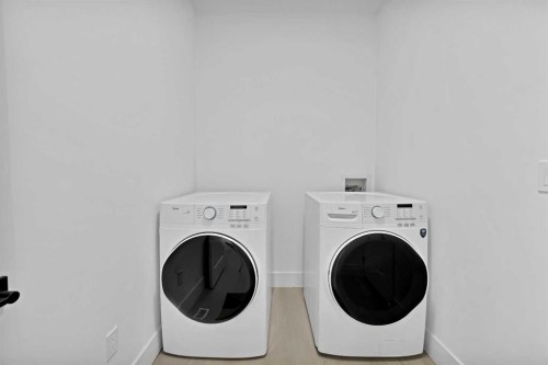 1125 Channelside Drive Sw, Airdrie, AB - Indoor Photo Showing Laundry Room