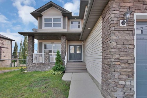 1125 Channelside Drive Sw, Airdrie, AB - Outdoor With Facade