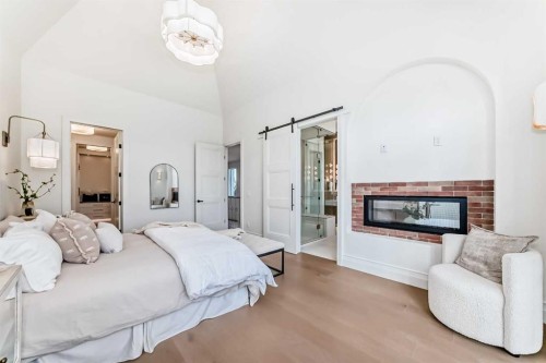 1610 49 Avenue Sw, Calgary, AB - Indoor Photo Showing Bedroom With Fireplace