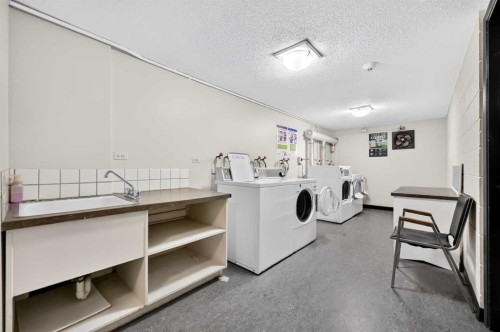 103-903 19 Avenue Sw, Calgary, AB - Indoor Photo Showing Laundry Room