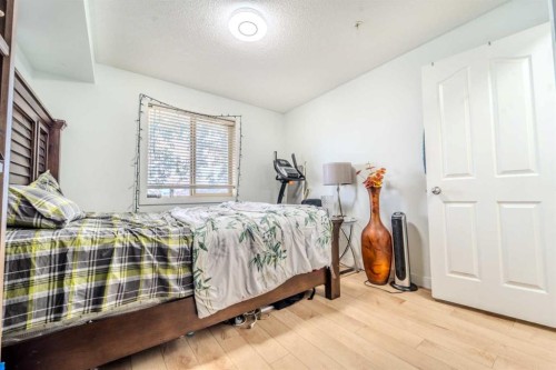 201-7180 80 Avenue Ne, Calgary, AB - Indoor Photo Showing Bedroom