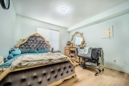 201-7180 80 Avenue Ne, Calgary, AB - Indoor Photo Showing Bedroom