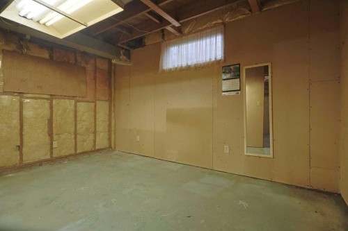 93 Winslow Crescent Sw, Calgary, AB - Indoor Photo Showing Basement