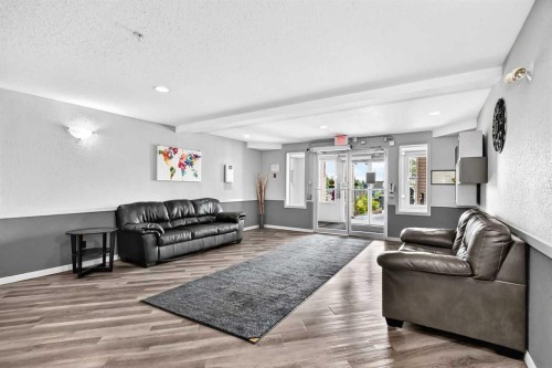 109-1717 60 Street Se, Calgary, AB - Indoor Photo Showing Living Room