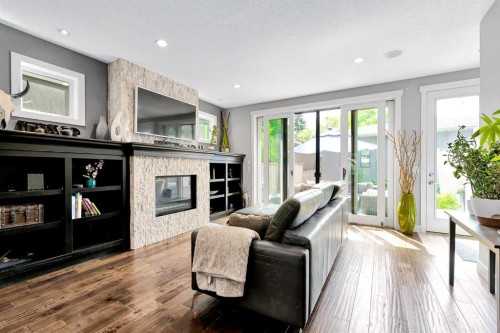 425 21 Avenue Nw, Calgary, AB - Indoor Photo Showing Living Room With Fireplace