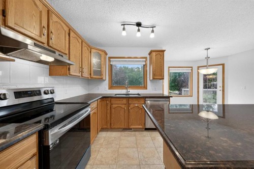 307 Edgeridge Gardens Nw, Calgary, AB - Indoor Photo Showing Kitchen With Stainless Steel Kitchen