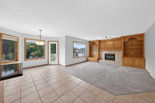307 Edgeridge Gardens Nw, Calgary, AB - Indoor Photo Showing Living Room With Fireplace
