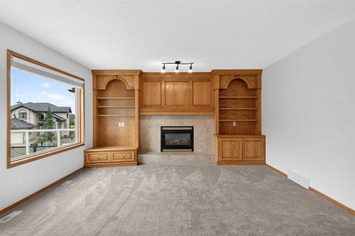 307 Edgeridge Gardens Nw, Calgary, AB - Indoor Photo Showing Living Room With Fireplace
