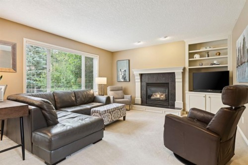 51 Sienna Park Crescent Sw, Calgary, AB - Indoor Photo Showing Living Room With Fireplace